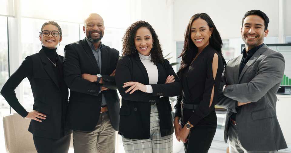 friendly and diverse group of real estate lawyers in office